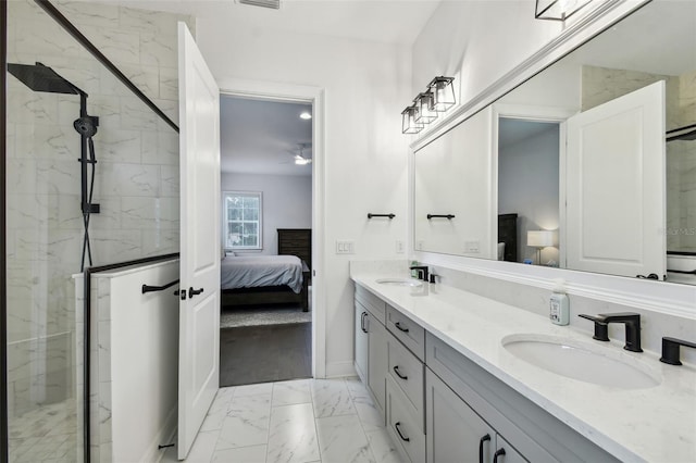 bathroom with vanity and a shower with shower door