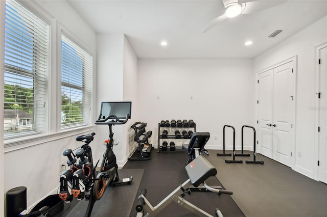 exercise room with ceiling fan