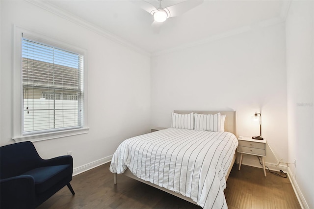 bedroom featuring dark wood-type flooring, crown molding, and ceiling fan