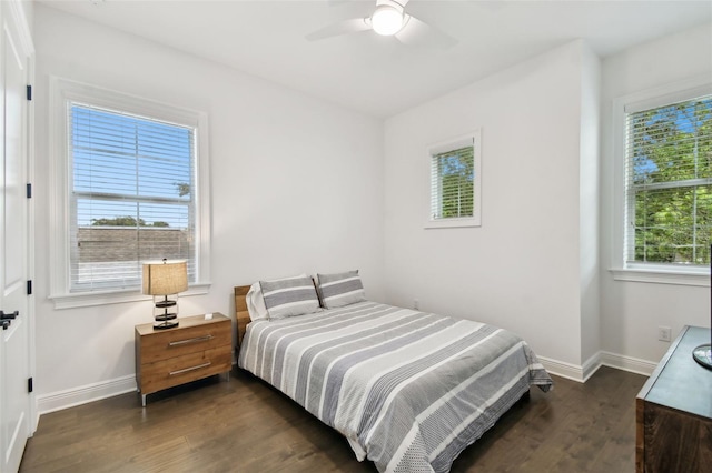 bedroom with ceiling fan and dark wood-type flooring