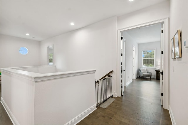 hallway with dark wood-type flooring