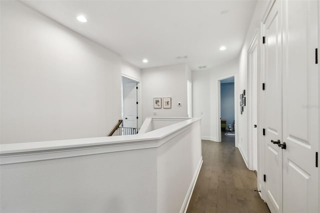 hall with dark hardwood / wood-style flooring