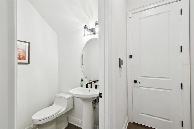 bathroom with sink and toilet