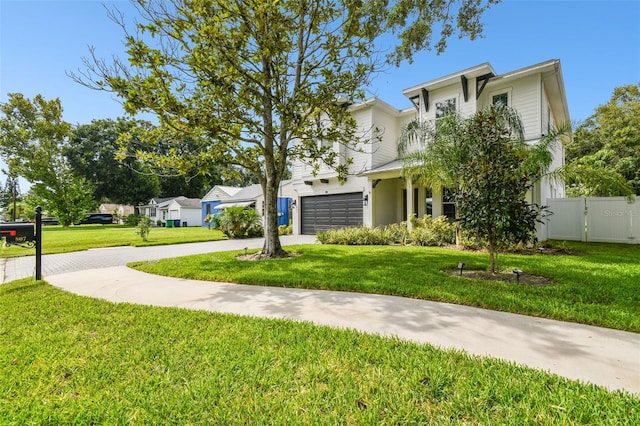 view of front facade with a garage and a front yard