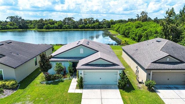 birds eye view of property featuring a water view