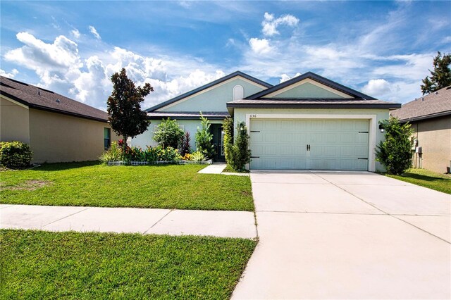 single story home with a front yard and a garage