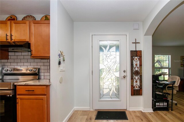 foyer with light wood-type flooring