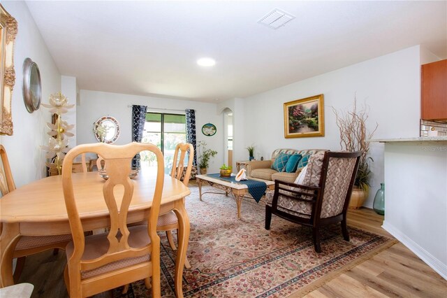 dining area with light hardwood / wood-style flooring