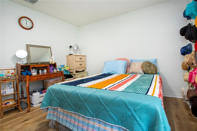 bedroom with light wood-type flooring