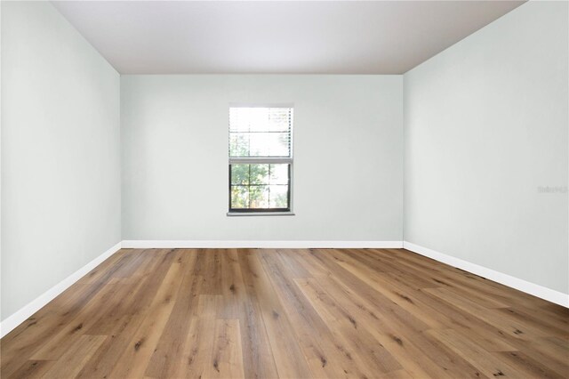 spare room with hardwood / wood-style flooring