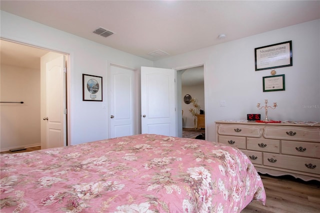 bedroom featuring wood-type flooring