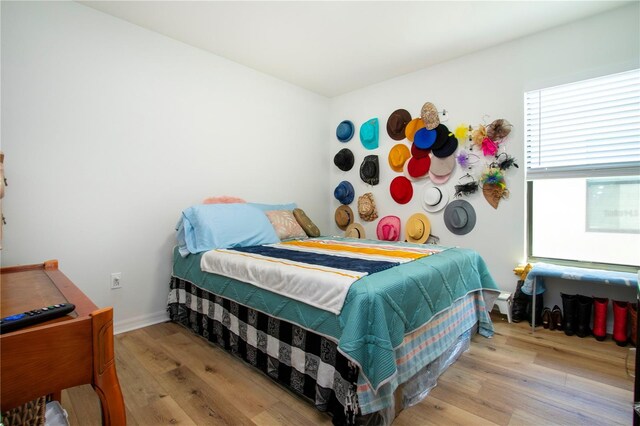 bedroom with light hardwood / wood-style flooring