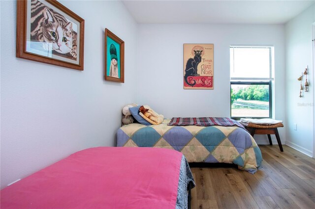 bedroom featuring hardwood / wood-style flooring