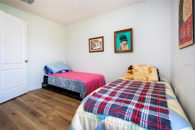 bedroom featuring hardwood / wood-style floors