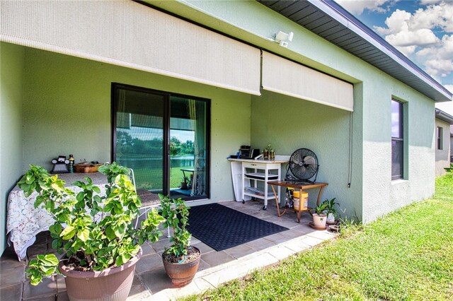 rear view of property with a patio area