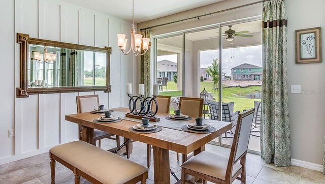 tiled dining room featuring ceiling fan with notable chandelier and plenty of natural light