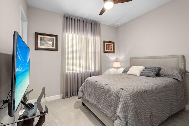 bedroom with light colored carpet and ceiling fan