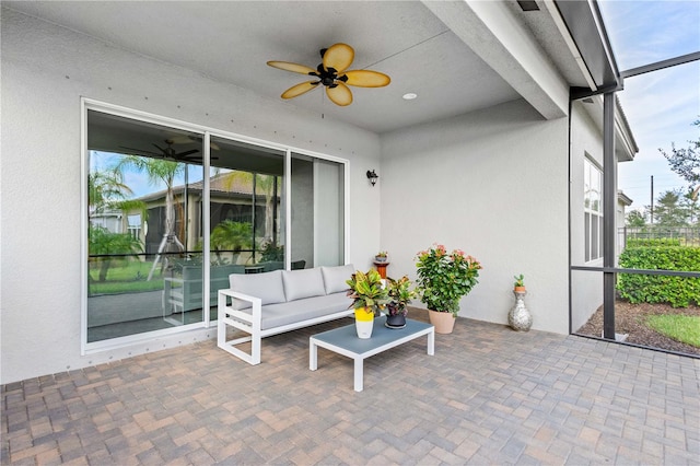 view of patio featuring ceiling fan and an outdoor living space