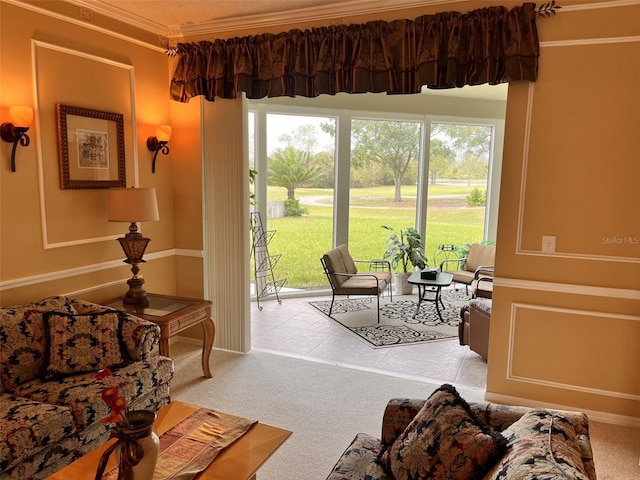 sitting room with carpet floors, plenty of natural light, and crown molding