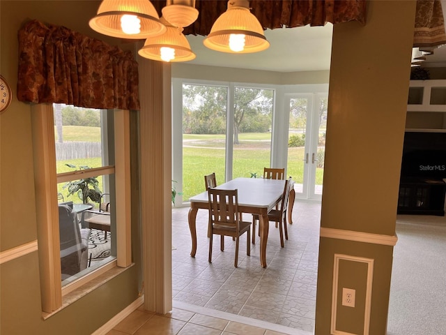 dining room with tile patterned flooring