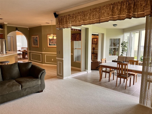 carpeted living room with an inviting chandelier and crown molding