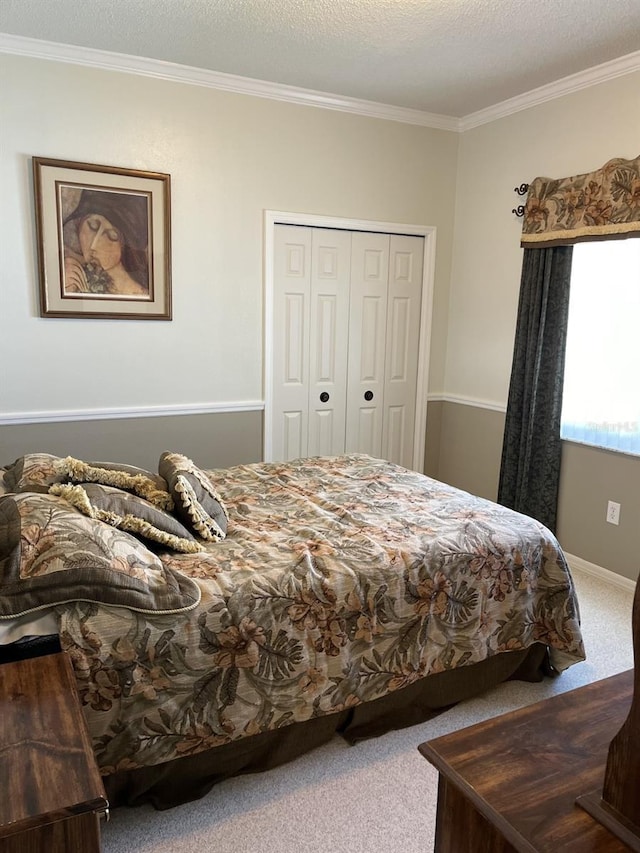 bedroom with carpet floors, a closet, and a textured ceiling