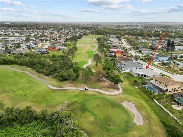 drone / aerial view featuring a residential view and view of golf course