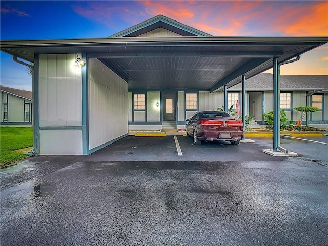 view of front of house featuring covered parking