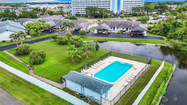 birds eye view of property with a water view