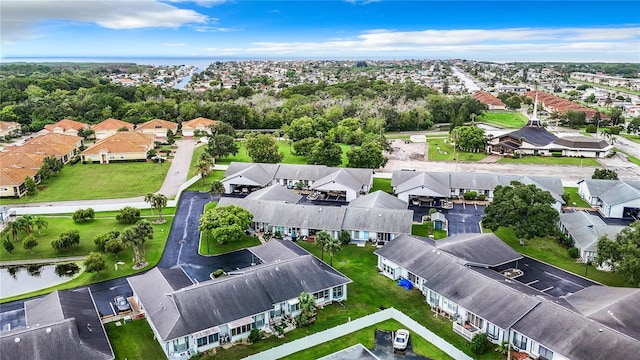 aerial view with a water view and a residential view