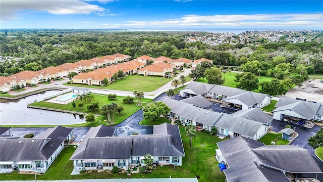 aerial view with a residential view and a water view