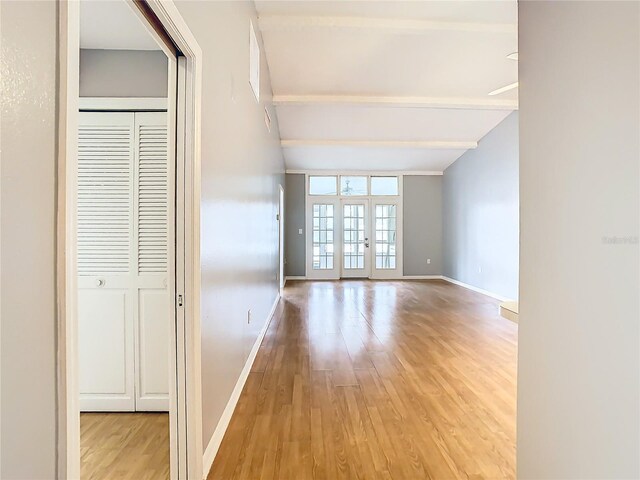 spare room with light hardwood / wood-style floors and french doors