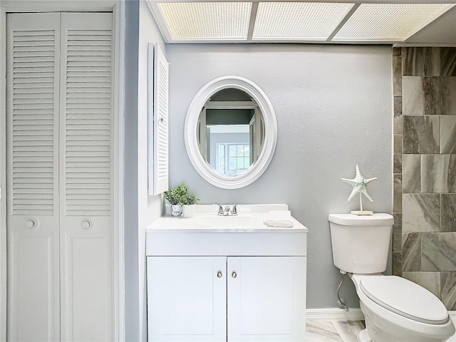 bathroom featuring toilet and vanity