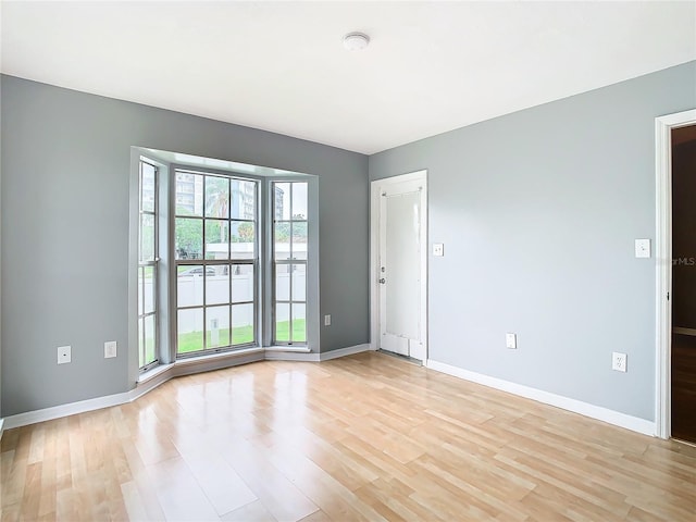 unfurnished room featuring light wood-type flooring