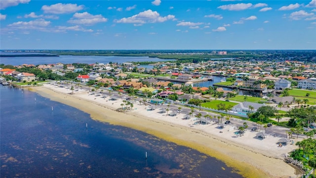 bird's eye view featuring a view of the beach and a water view