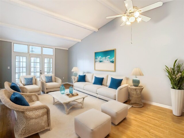 living room with ceiling fan, beam ceiling, high vaulted ceiling, and light wood-type flooring