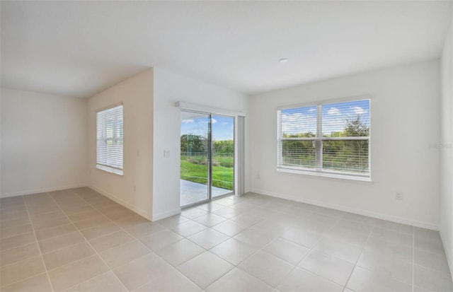 empty room with light tile patterned floors