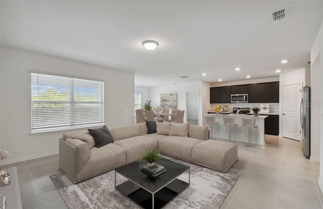 living room with light tile patterned flooring