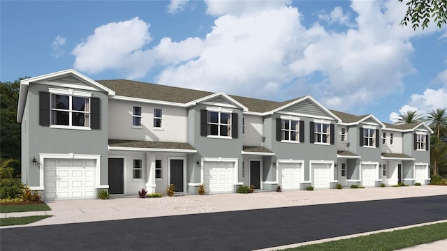 view of property featuring driveway, an attached garage, a residential view, and stucco siding