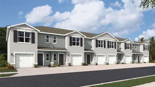 view of property featuring a residential view, driveway, an attached garage, and stucco siding