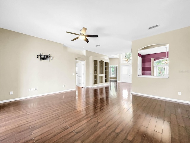 unfurnished living room with ceiling fan and wood-type flooring