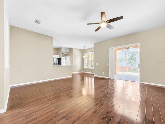 unfurnished living room with ceiling fan and hardwood / wood-style floors