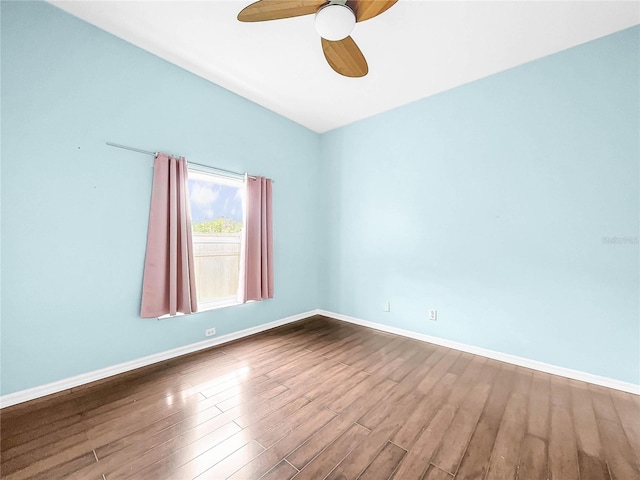 empty room featuring ceiling fan and wood-type flooring