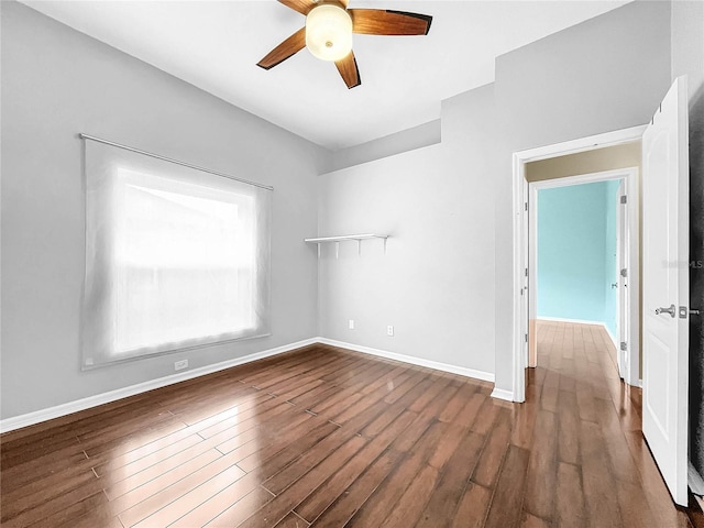 empty room featuring hardwood / wood-style floors and ceiling fan