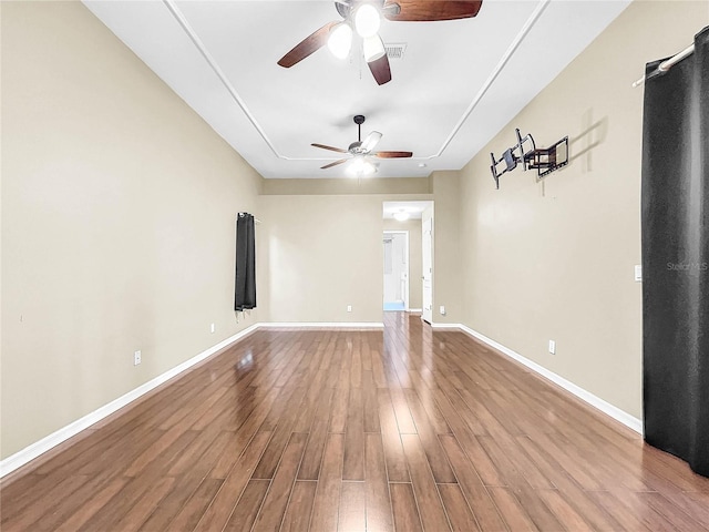 spare room with ceiling fan and hardwood / wood-style floors