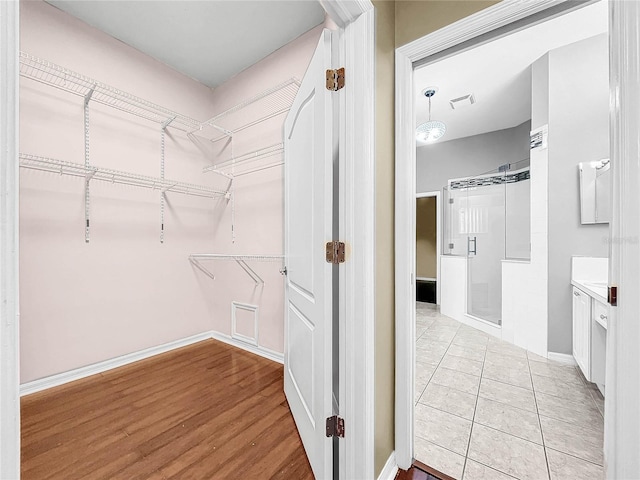 walk in closet featuring light wood-type flooring