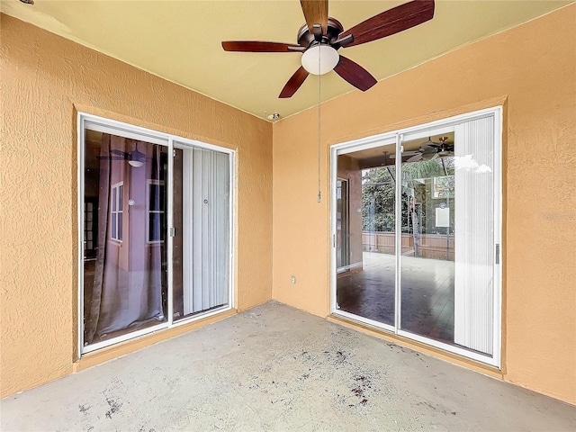 view of patio featuring ceiling fan