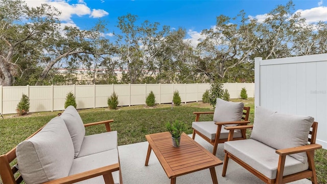 view of patio / terrace with a fenced backyard and an outdoor living space