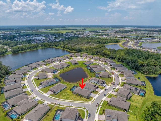 bird's eye view featuring a residential view and a water view