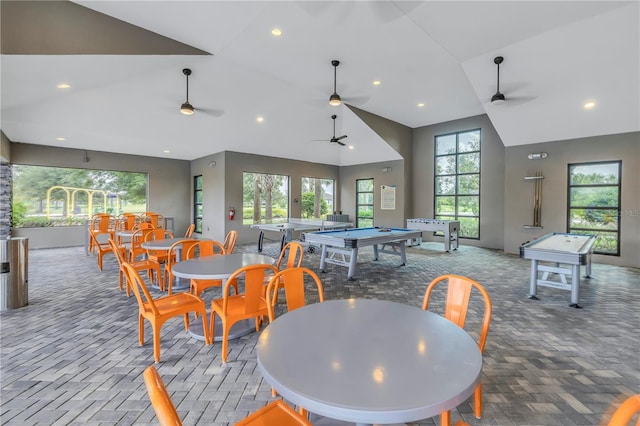 dining room featuring plenty of natural light, recessed lighting, lofted ceiling, and carpet floors